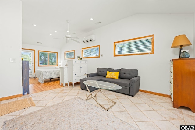 4005 Ivy Ln Lot # 16, Kitty Hawk, NC 27949 - living area featuring vaulted ceiling, an AC wall unit, ceiling fan, light tile patterned flooring, and baseboards