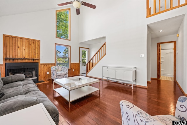 4005 Ivy Ln Lot # 16, Kitty Hawk, NC 27949 - living area featuring a towering ceiling, stairs, plenty of natural light, hardwood / wood-style flooring, and wainscoting