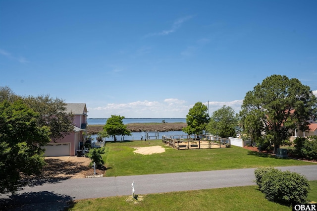 4005 Ivy Ln Lot # 16, Kitty Hawk, NC 27949 - view of property's community with a water view, a lawn, and a garage