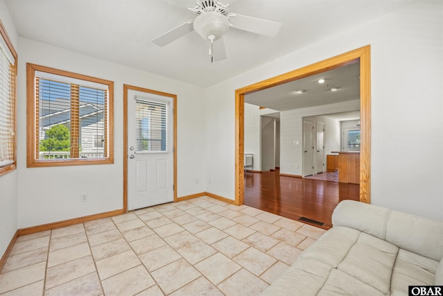 4005 Ivy Ln Lot # 16, Kitty Hawk, NC 27949 - spare room featuring light tile patterned floors, baseboards, and a ceiling fan