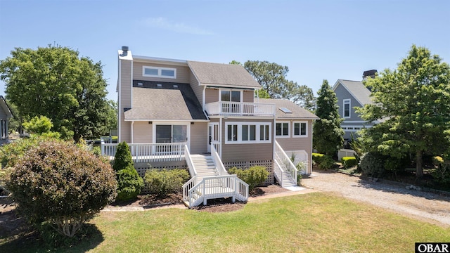 4005 Ivy Ln Lot # 16, Kitty Hawk, NC 27949 - rear view of property with stairs, dirt driveway, a balcony, and a lawn