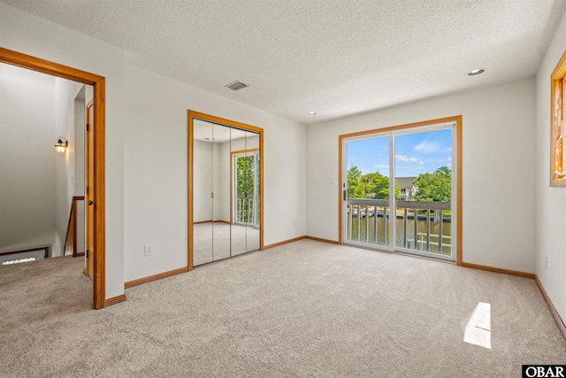 4005 Ivy Ln Lot # 16, Kitty Hawk, NC 27949 - empty room with carpet, a textured ceiling, and baseboards