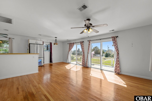 1612 Harbour View Dr Lot 114, Kill Devil Hills, NC 27948 - unfurnished living room with a ceiling fan, light wood finished floors, and baseboards