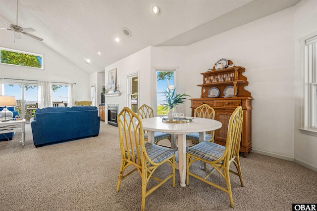 506 Magnolia Way Lot 29, Corolla, NC 27927 - dining area featuring light carpet, healthy amount of natural light, high vaulted ceiling, ceiling fan, and recessed lighting