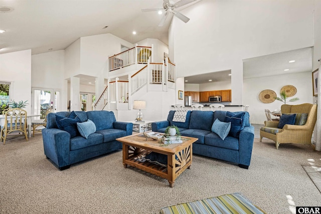 506 Magnolia Way Lot 29, Corolla, NC 27927 - living room with high vaulted ceiling, light colored carpet, stairs, a ceiling fan, and recessed lighting