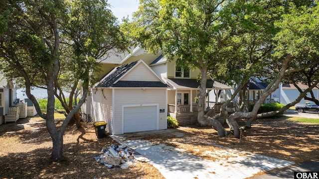 506 Magnolia Way Lot 29, Corolla, NC 27927 - view of front of home featuring driveway, a shingled roof, and a garage
