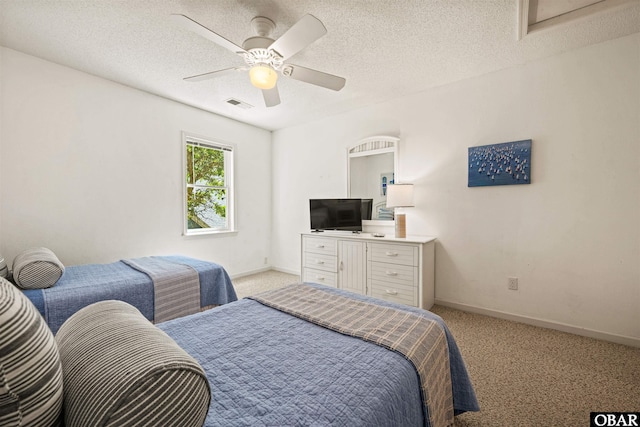 506 Magnolia Way Lot 29, Corolla, NC 27927 - bedroom with light colored carpet, a ceiling fan, and a textured ceiling
