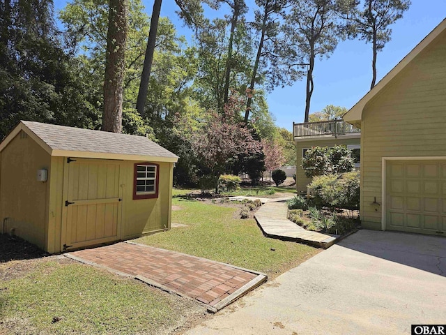 56 Deer Path Ln Lot 413, Southern Shores, NC 27949 - view of yard with an outbuilding, driveway, and a storage unit