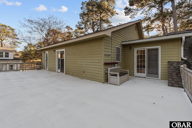 back of property featuring a patio area