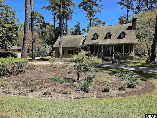 56 Deer Path Ln Lot 413, Southern Shores, NC 27949 - cape cod house featuring a chimney and covered porch