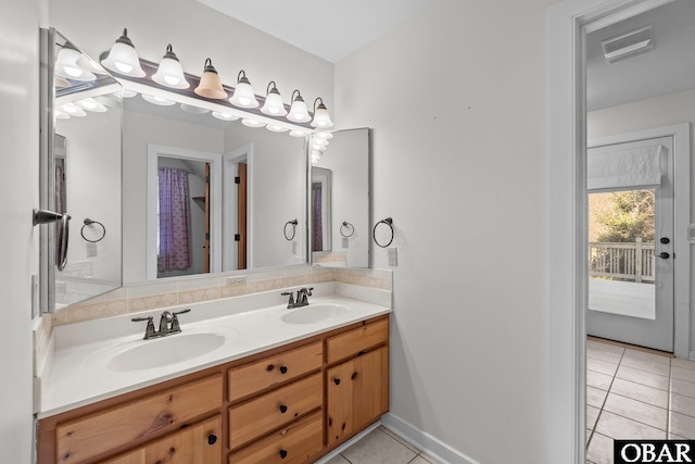 full bathroom with double vanity, visible vents, a sink, and tile patterned floors