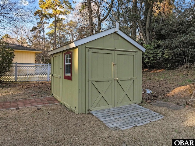 view of shed with fence