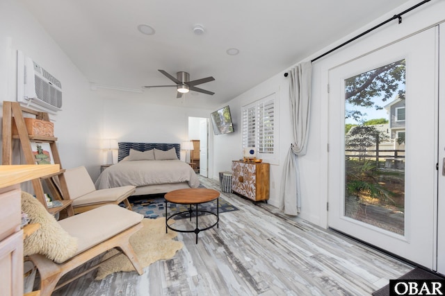 24 First Ave Lot # 14, Southern Shores, NC 27949 - bedroom with access to outside, ceiling fan, a wall mounted AC, and wood finished floors