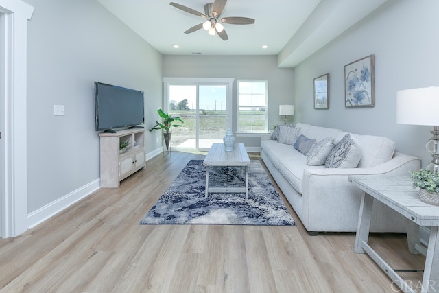 living room with light wood-style floors, recessed lighting, baseboards, and a ceiling fan