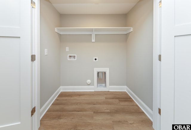 laundry area featuring gas dryer hookup, hookup for a washing machine, baseboards, light wood-style floors, and electric dryer hookup