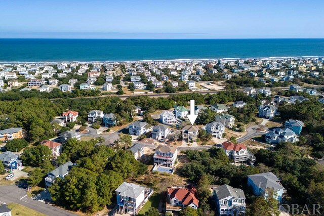 birds eye view of property featuring a residential view and a water view