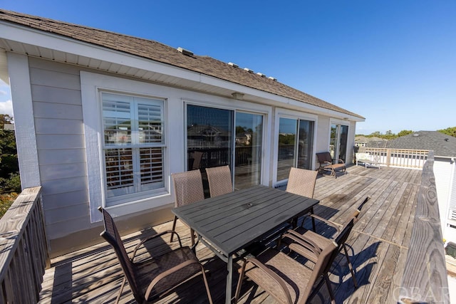 deck with outdoor dining space