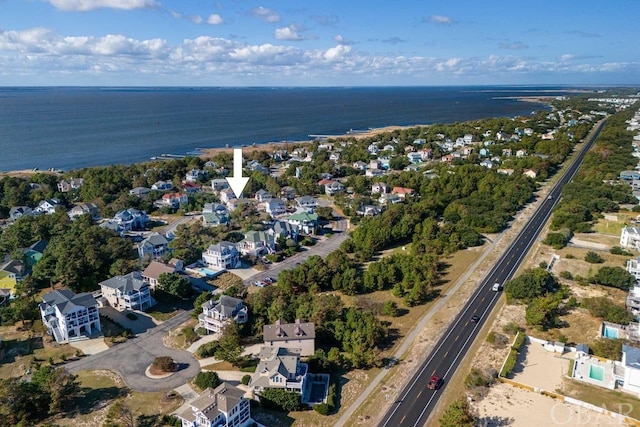 bird's eye view featuring a water view and a residential view