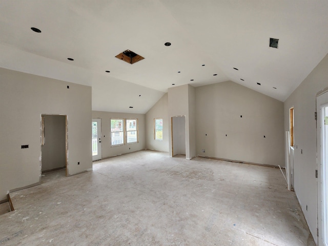 spare room featuring high vaulted ceiling