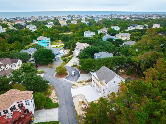 birds eye view of property with a water view and a residential view