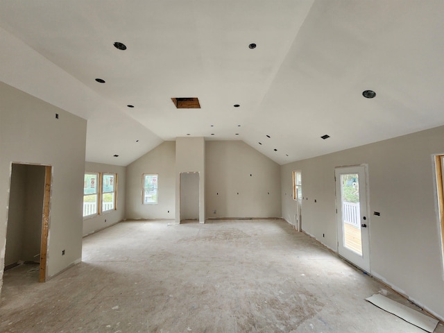 spare room with vaulted ceiling