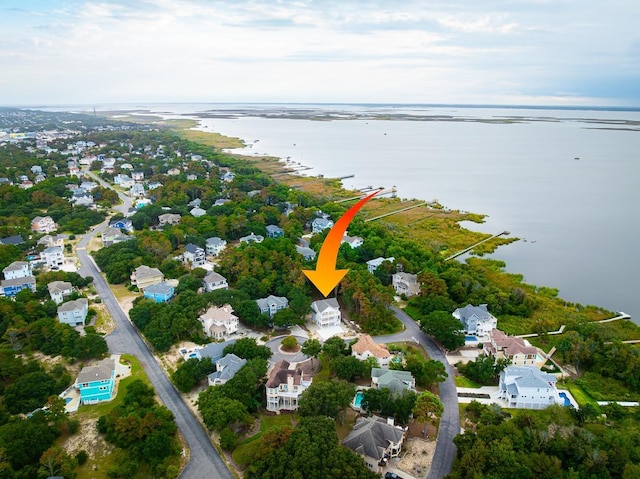 bird's eye view with a water view and a residential view