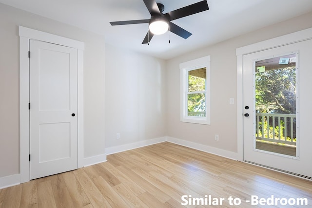 unfurnished room featuring light wood-style floors, ceiling fan, and baseboards