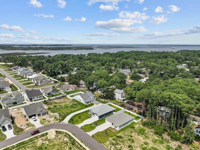 birds eye view of property with a water view, a forest view, and a residential view