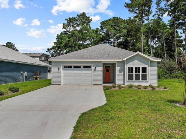 ranch-style home featuring a garage, driveway, a front lawn, and board and batten siding