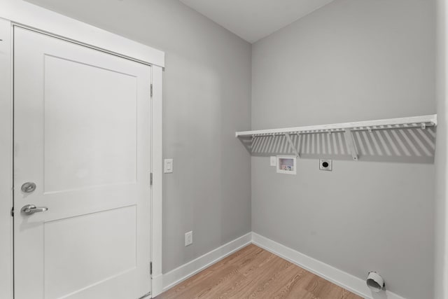 clothes washing area with laundry area, washer hookup, baseboards, light wood finished floors, and electric dryer hookup