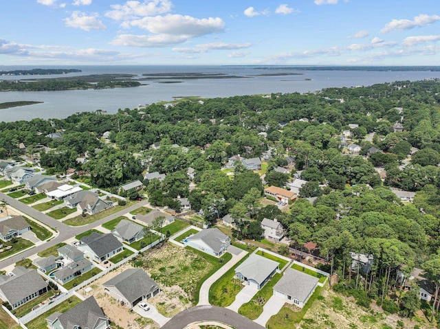 birds eye view of property featuring a water view and a residential view