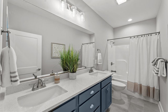 full bathroom featuring shower / bath combination with curtain, double vanity, a sink, and toilet