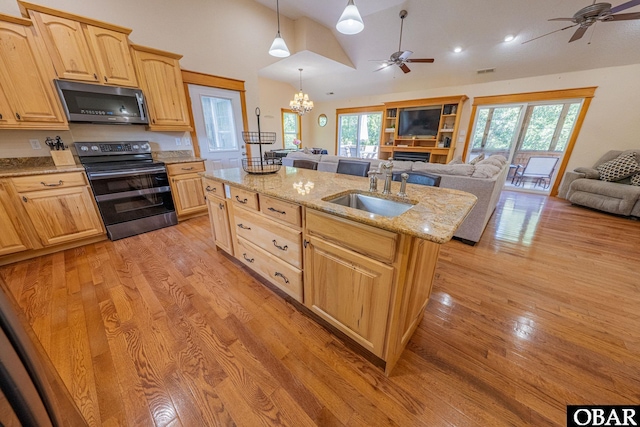 102 Settlers Ln Lot 7R, Duck, NC 27949 - kitchen featuring electric range oven, stainless steel microwave, open floor plan, ceiling fan, and lofted ceiling