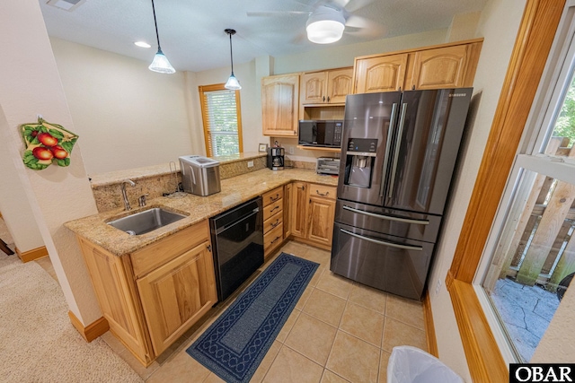102 Settlers Ln Lot 7R, Duck, NC 27949 - kitchen featuring black appliances, light brown cabinets, light stone countertops, healthy amount of natural light, and recessed lighting
