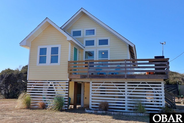 view of front of property with a wooden deck