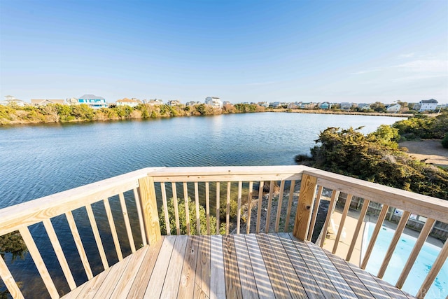 wooden deck featuring a water view