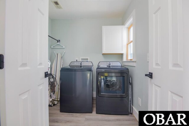 131B Jay Crest Rd Unit 801, Duck, NC 27949 - washroom with washing machine and dryer and light wood-type flooring