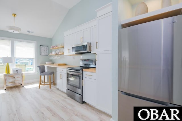 131B Jay Crest Rd Unit 801, Duck, NC 27949 - kitchen with appliances with stainless steel finishes, open shelves, light wood-type flooring, white cabinets, and high vaulted ceiling