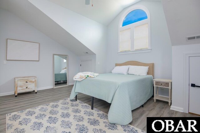 131B Jay Crest Rd Unit 801, Duck, NC 27949 - bedroom featuring vaulted ceiling and wood finished floors