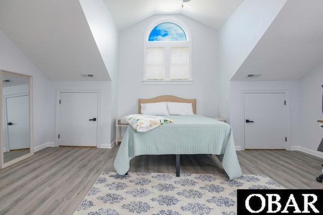 131B Jay Crest Rd Unit 801, Duck, NC 27949 - bedroom featuring vaulted ceiling and light wood finished floors