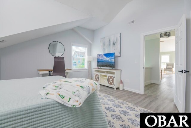 131B Jay Crest Rd Unit 801, Duck, NC 27949 - bedroom featuring lofted ceiling, wood finished floors, and an office area