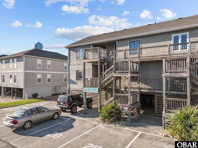 627 Sand Fiddler Cir Unit B-1, Corolla, NC 27927 - view of building exterior with uncovered parking and stairway
