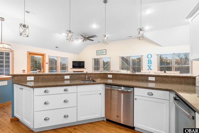 757 Fishermans Ct Lot 66, Corolla, NC 27927 - kitchen featuring light wood-type flooring, pendant lighting, a sink, stainless steel dishwasher, and vaulted ceiling