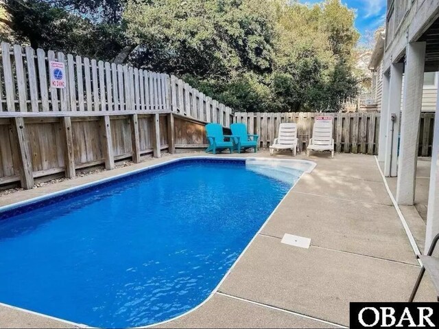 757 Fishermans Ct Lot 66, Corolla, NC 27927 - view of swimming pool with a fenced in pool, a fenced backyard, and a patio area