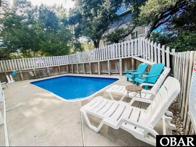 757 Fishermans Ct Lot 66, Corolla, NC 27927 - view of pool featuring a fenced in pool, a fenced backyard, and a patio area