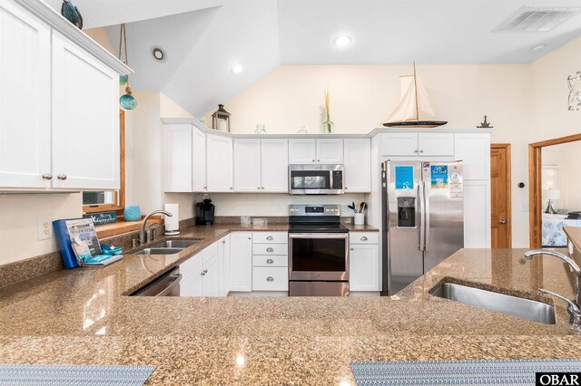 757 Fishermans Ct Lot 66, Corolla, NC 27927 - kitchen with a sink, visible vents, appliances with stainless steel finishes, and white cabinets
