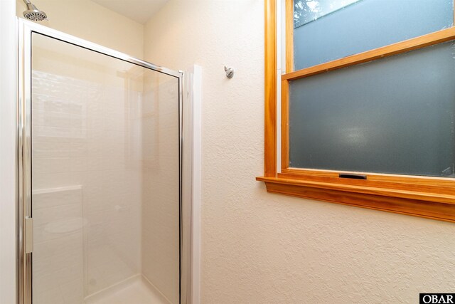 757 Fishermans Ct Lot 66, Corolla, NC 27927 - full bathroom with a stall shower and a textured wall