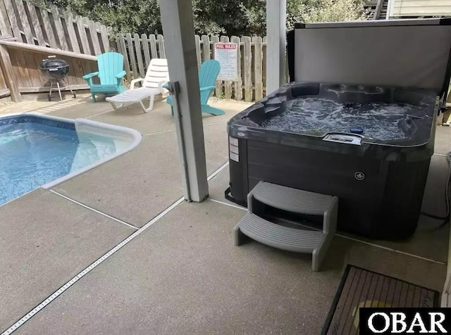757 Fishermans Ct Lot 66, Corolla, NC 27927 - view of pool featuring a patio area, a hot tub, and fence