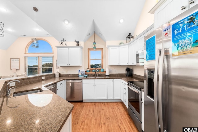757 Fishermans Ct Lot 66, Corolla, NC 27927 - kitchen featuring a sink, lofted ceiling, white cabinetry, and stainless steel appliances