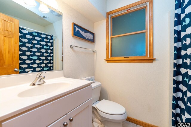 757 Fishermans Ct Lot 66, Corolla, NC 27927 - bathroom featuring visible vents, toilet, baseboards, vanity, and a textured wall